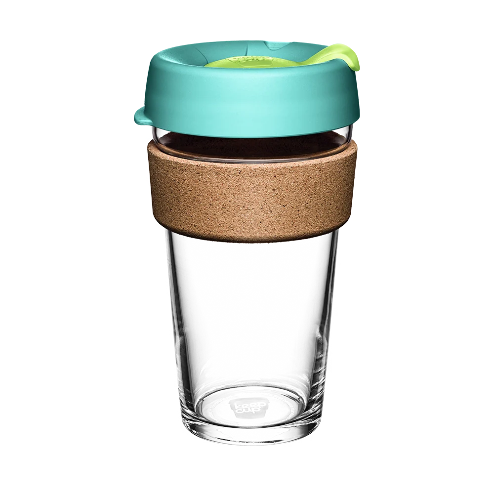 Clear glass reusable cup with a turquoise lid and cork sleeve on a white background