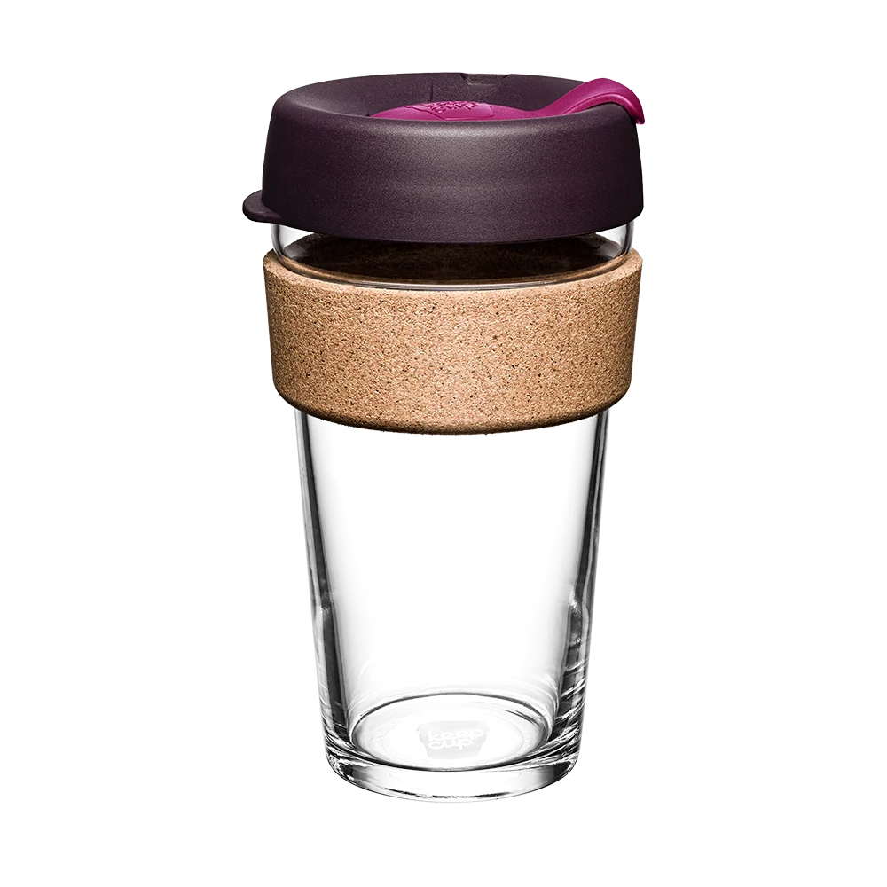 Clear glass reusable coffee cup with a purple lid and cork sleeve on a white background