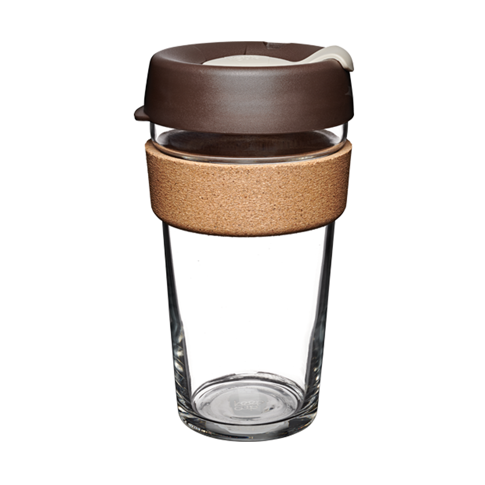 Clear glass reusable coffee cup with brown lid and cork sleeve on a white background
