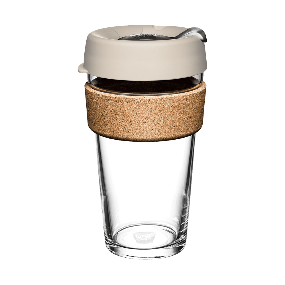 Clear glass mug with a beige lid and cork sleeve on a white background