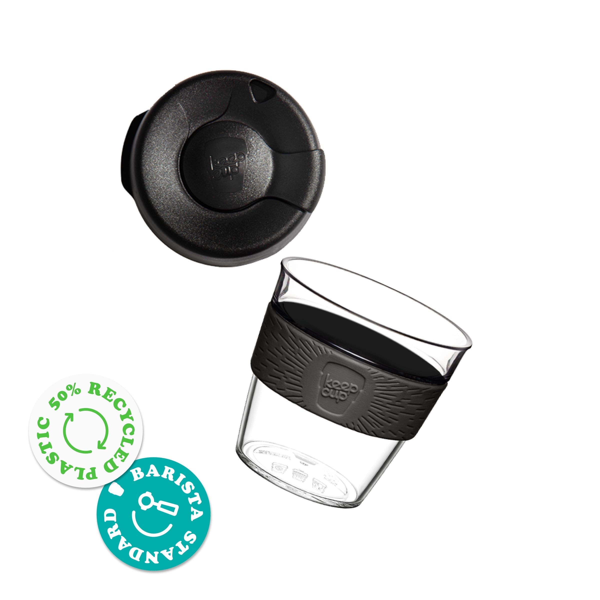 KeepCup Original Clear S 8oz shown with the lid separated from the clear glass cup featuring a silicone band. Badges indicate 50% recycled plastic and Barista Standard certification.