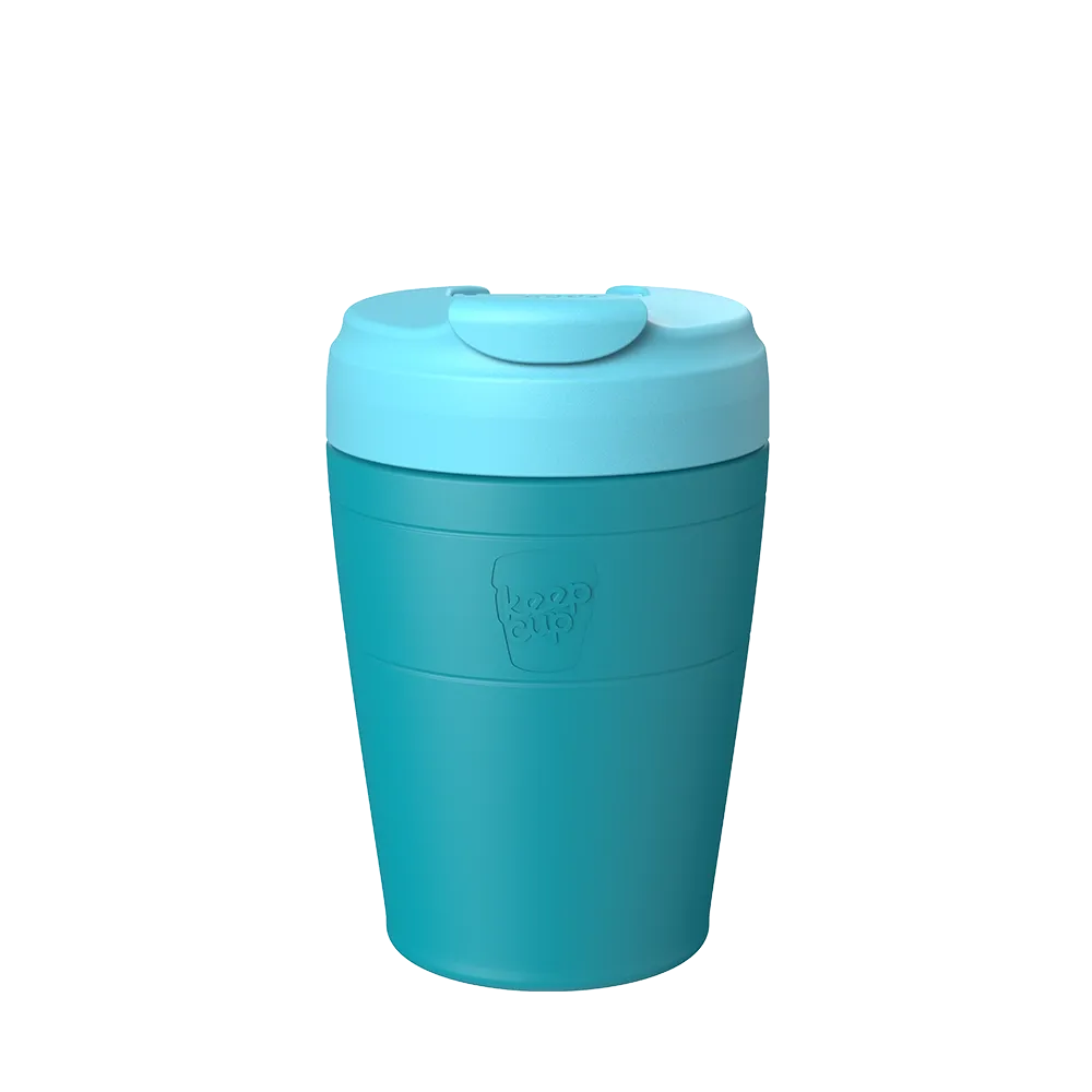 Medium turquoise travel tumbler with a light blue lid on a white background