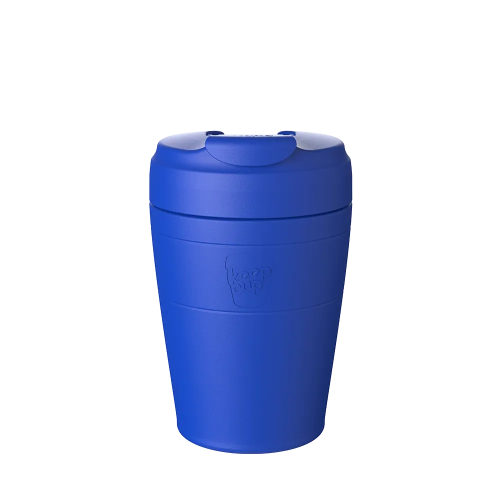 Blue reusable coffee mug with a lid on a white background