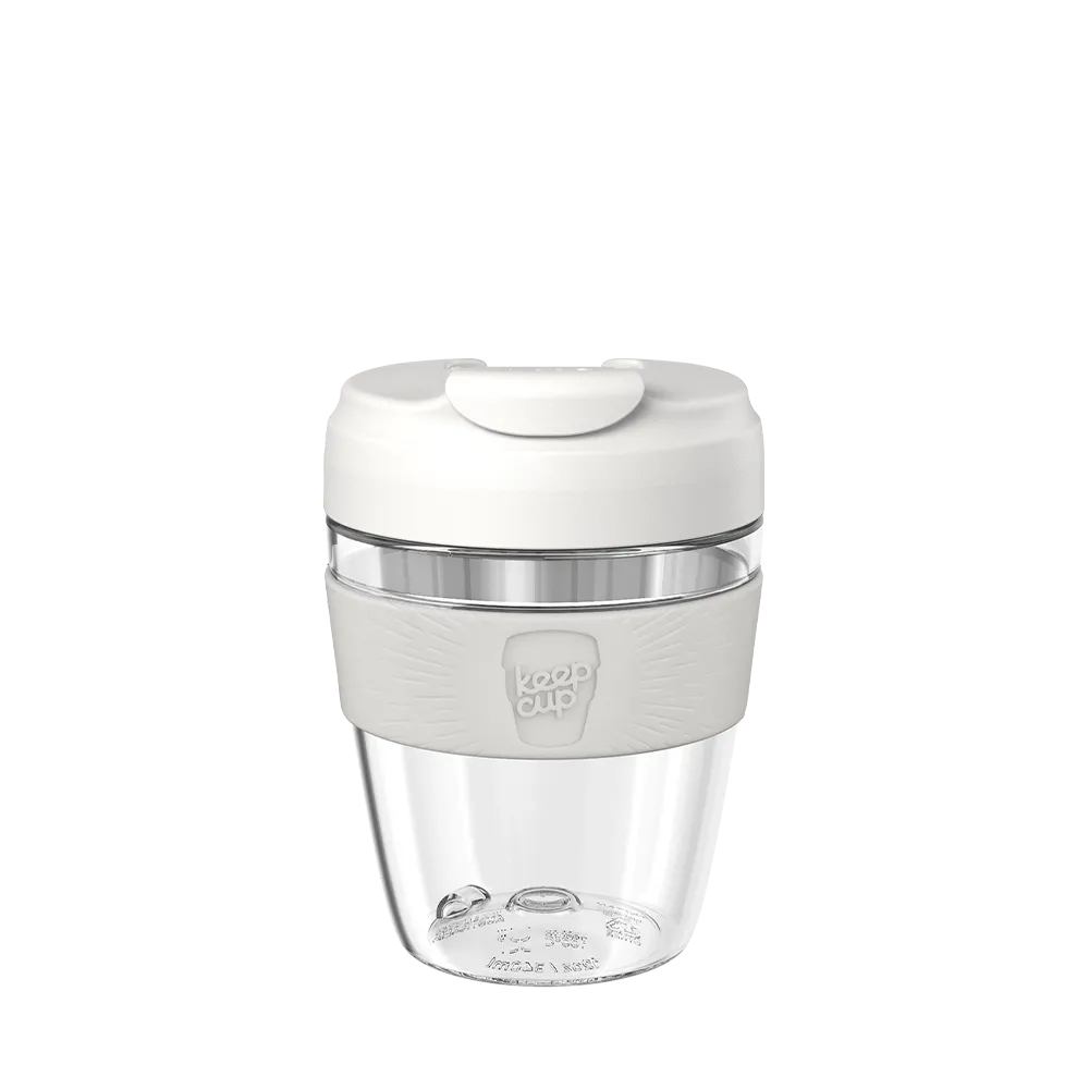 Reusable coffee cup with a bone lid on a white background