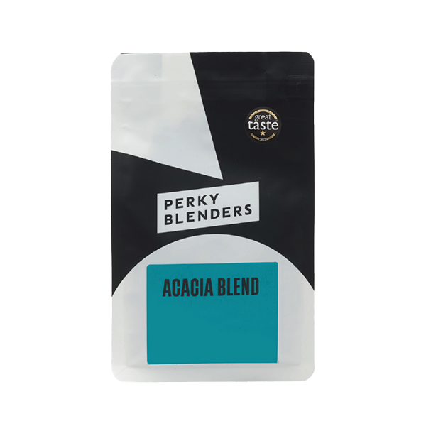 Perky Blenders Acacia Blend 1 kg coffee bag in black and white packaging with a teal label, featuring a Great Taste award badge, photographed front-on against a white background.