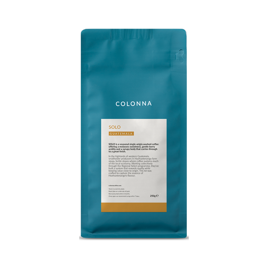 Teal coffee bag of Colonna SOLO Guatemala single-origin coffee beans, 250g package with white and orange label