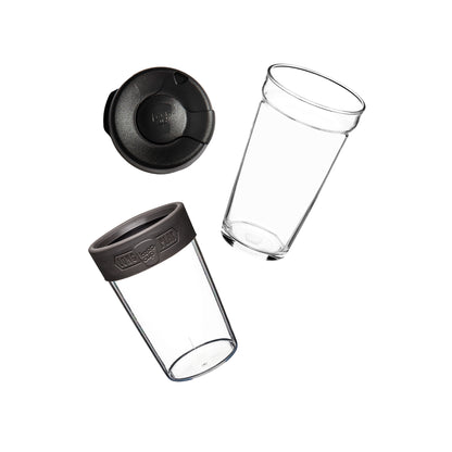 Flat lay showing the KeepCup Brew Longplay L 16oz disassembled into its components: sipper lid, clear glass cup, plastic outer sleeve and silicone band.