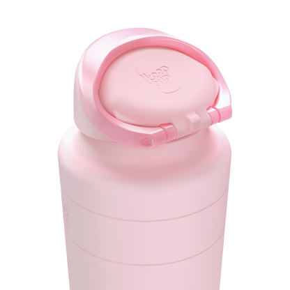 Pink water bottle with a matching cap on a white background