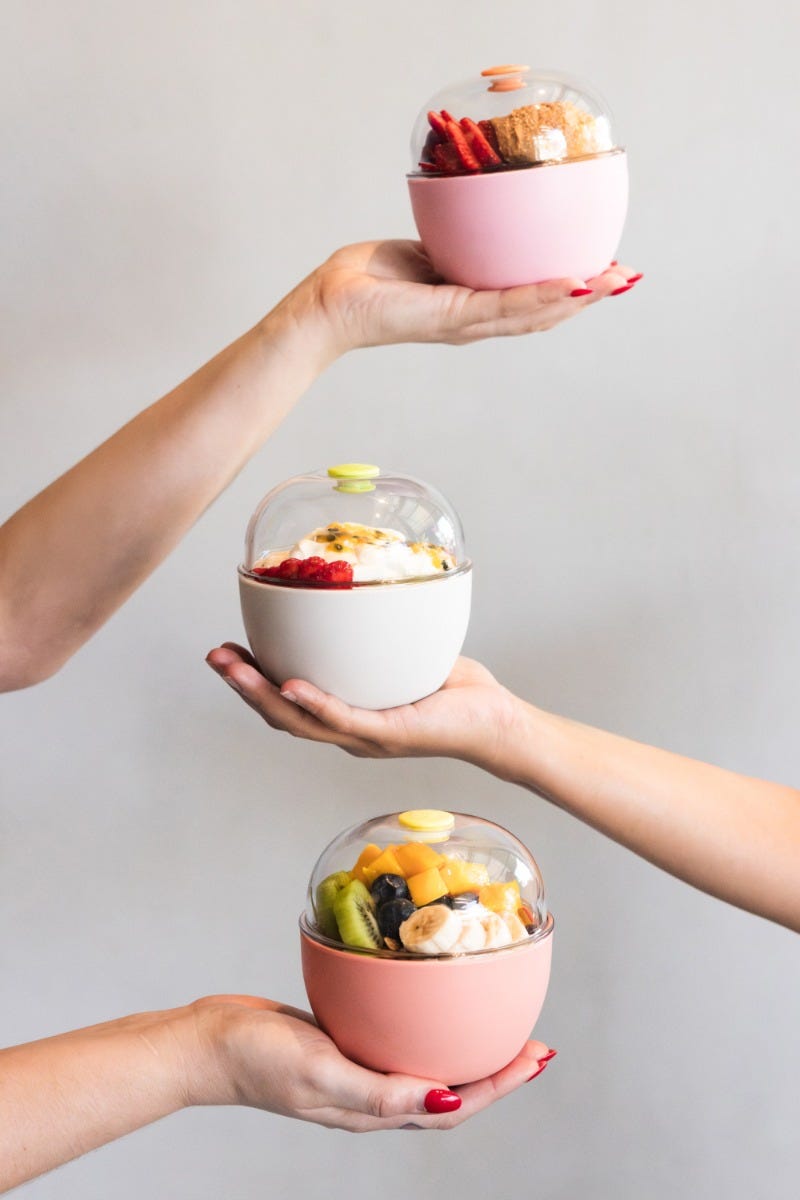 Woman holding KeepCup Go Bowl filled with acai bowl