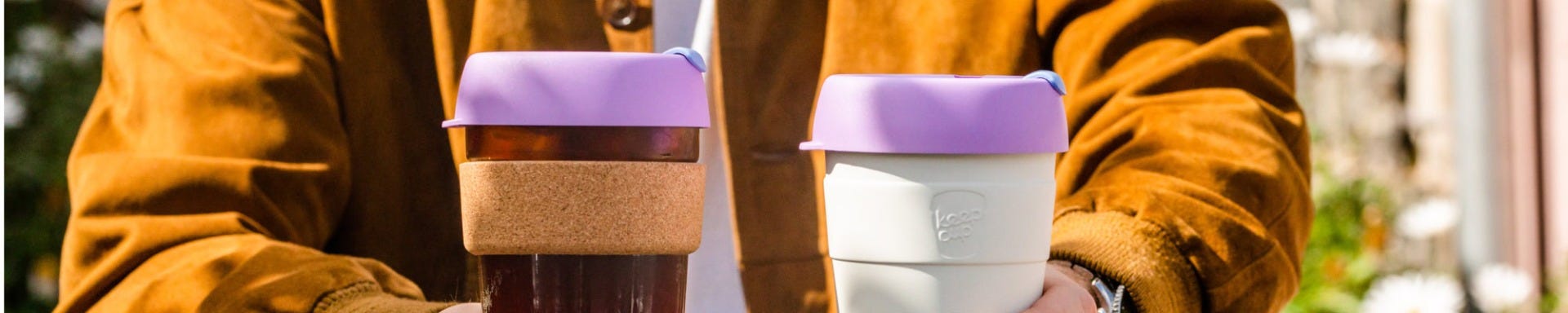 Man holding KeepCup Brew Cork and KeepCup Thermal