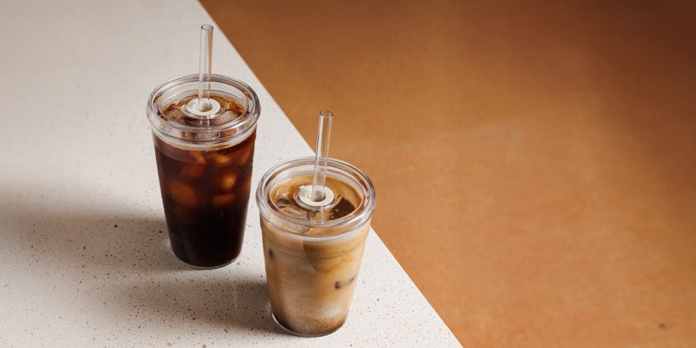 KeepCup Cold Cup Original in 16oz on bench with iced latte and iced coffee